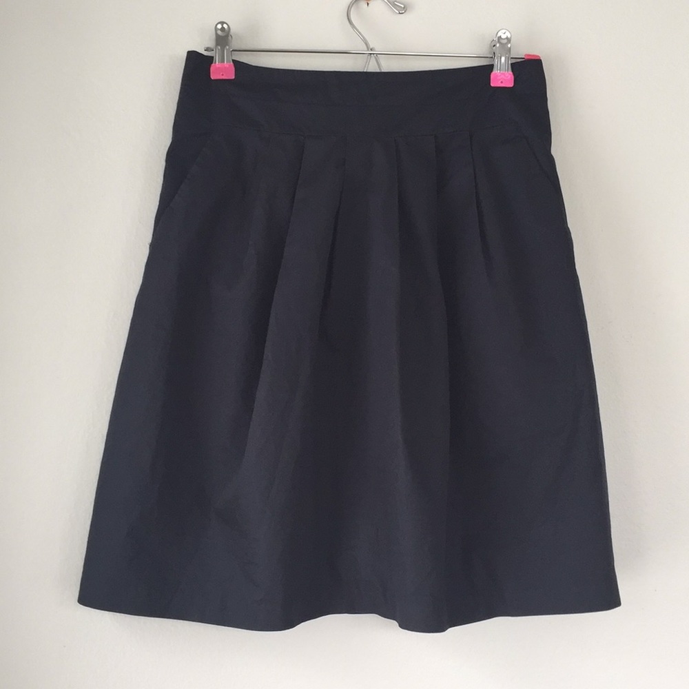 Pleated skirt with pockets